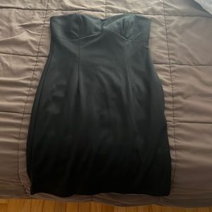 Mini black dress. Worn. Little beat but no tares or holes.